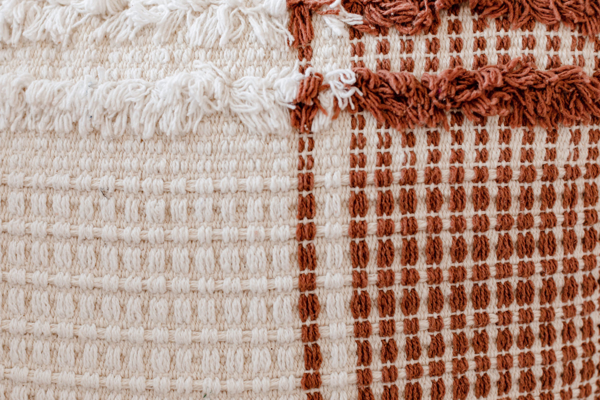A closeup of the texture and colour of a pillow in our waiting area.