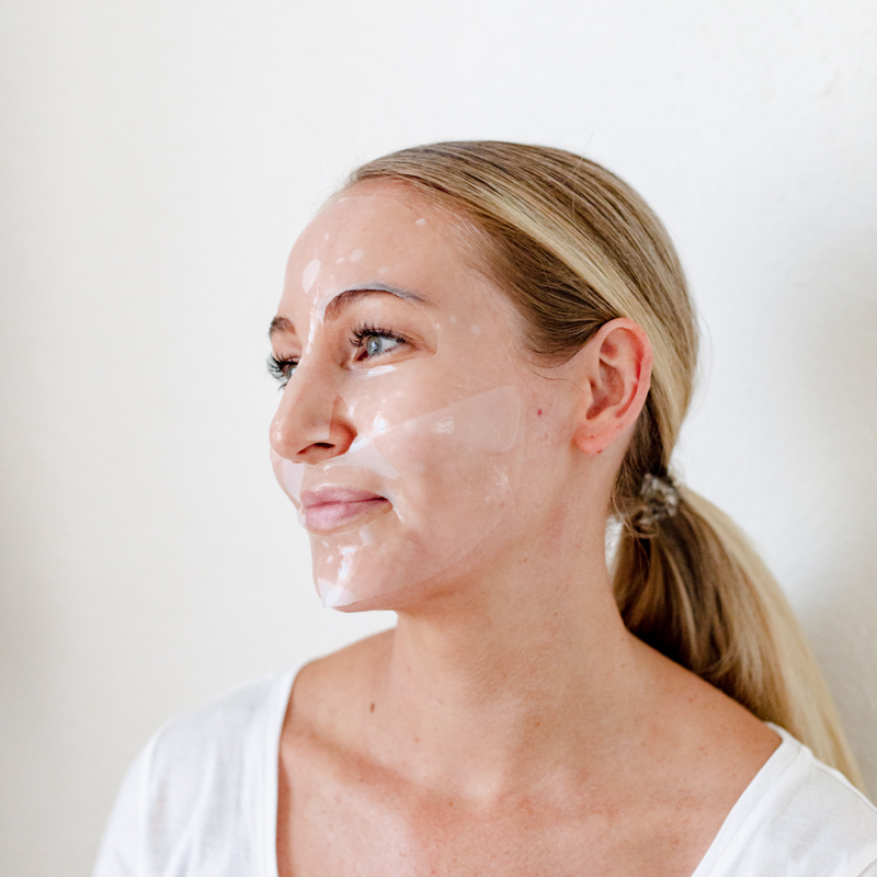 Client glowing in her Société Rejuvenating Peptide Mask.